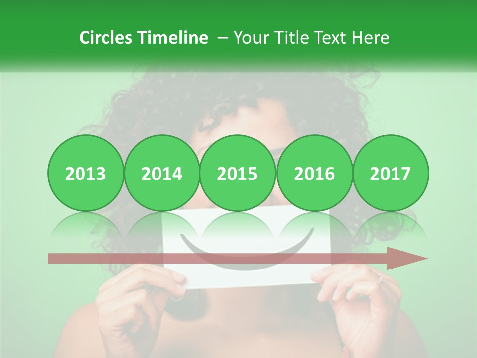 A Woman Holding A Card With A Smiley Face On It PowerPoint Template