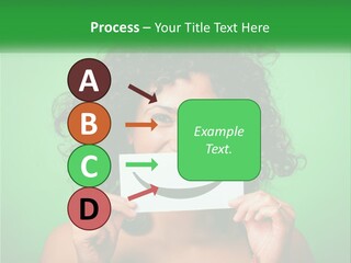 A Woman Holding A Card With A Smiley Face On It PowerPoint Template