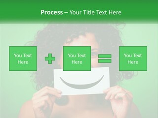 A Woman Holding A Card With A Smiley Face On It PowerPoint Template