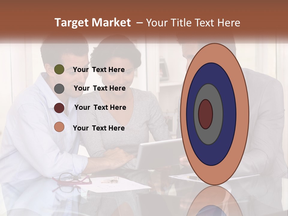 A Group Of People Sitting Around A Table Looking At A Tablet PowerPoint Template