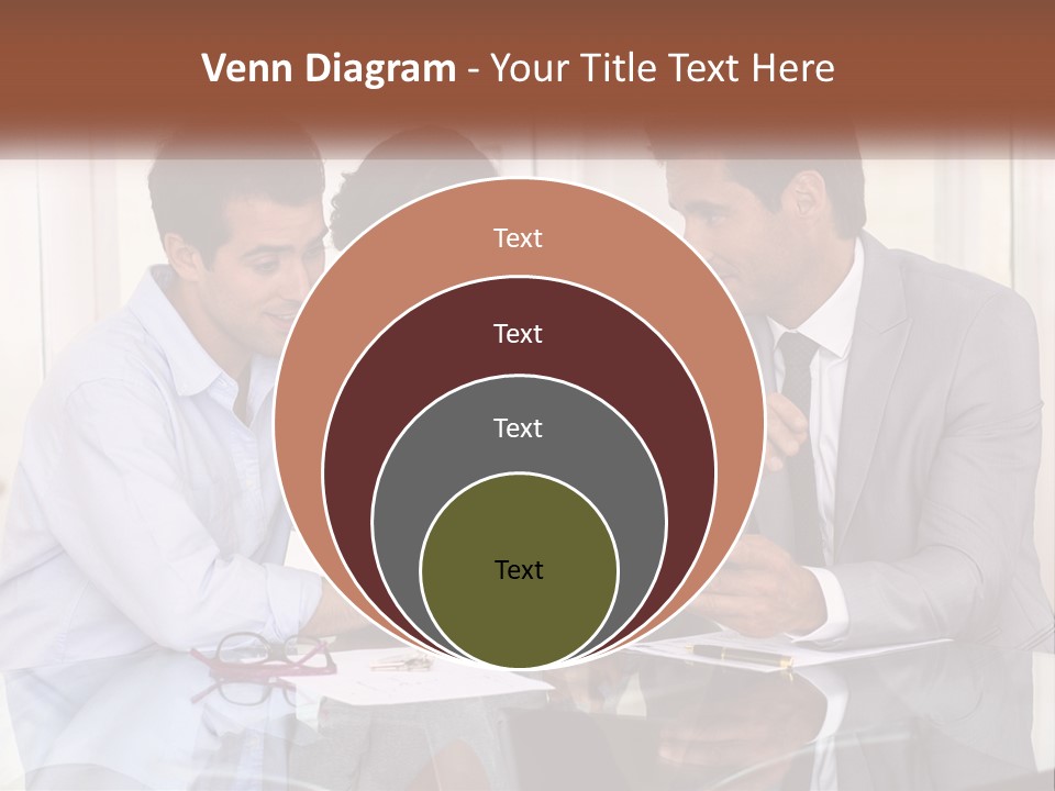 A Group Of People Sitting Around A Table Looking At A Tablet PowerPoint Template