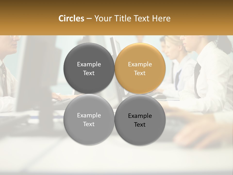 A Group Of People Working On Computers In An Office PowerPoint Template