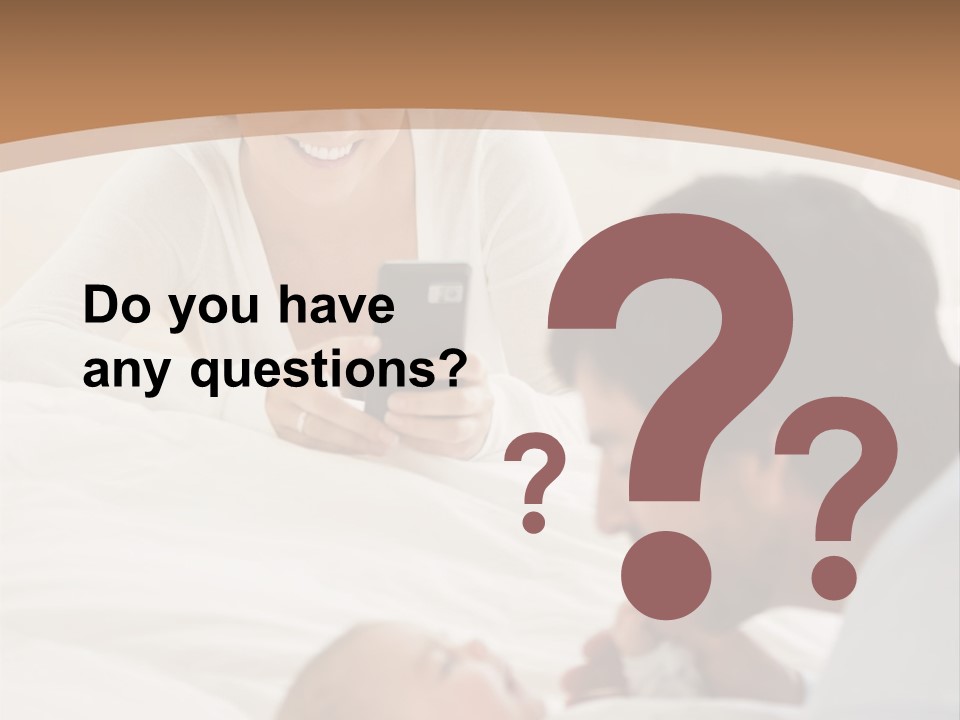 A Man And Woman Looking At A Cell Phone While Holding A Baby PowerPoint Template