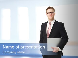 A Man In A Suit And Tie Holding A Laptop PowerPoint Template