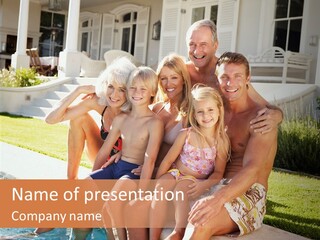 A Family Is Posing For A Picture In Front Of A House PowerPoint Template
