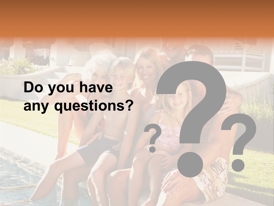 A Family Is Posing For A Picture In Front Of A House PowerPoint Template