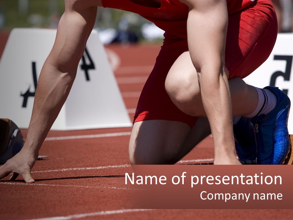A Person Kneeling Down On A Track With A Number On It PowerPoint Template