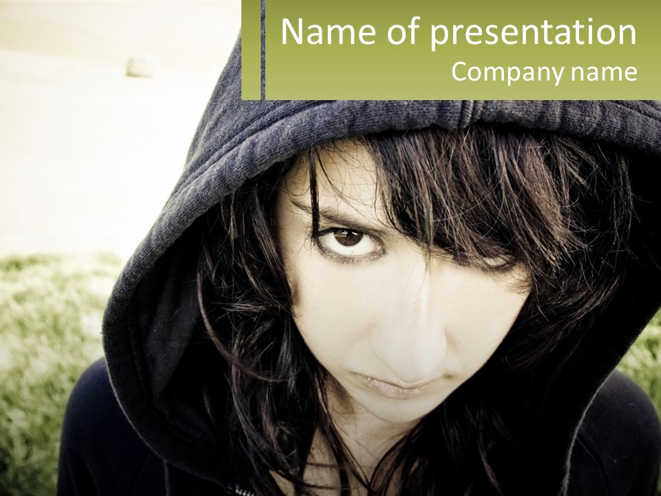 A Woman In A Hoodie Is Looking At The Camera PowerPoint Template