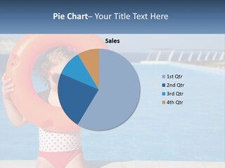 A Little Girl Holding An Orange Life Preserver In Front Of A Swimming Pool PowerPoint Template