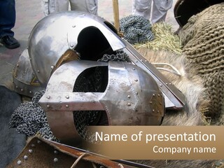 A Large Metal Helmet Sitting On Top Of A Pile Of Hay PowerPoint Template