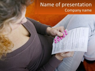 A Woman Sitting On A Couch Holding A Piece Of Paper PowerPoint Template