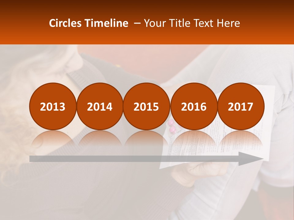 A Woman Sitting On A Couch Holding A Piece Of Paper PowerPoint Template