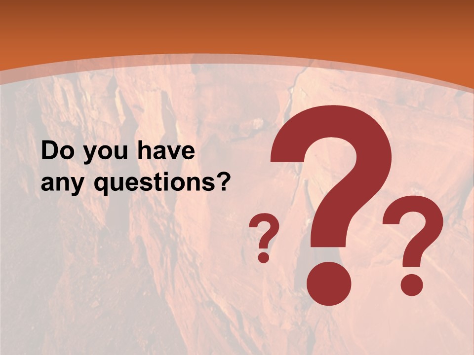 A Rocky Cliff With A Mountain In The Background PowerPoint Template