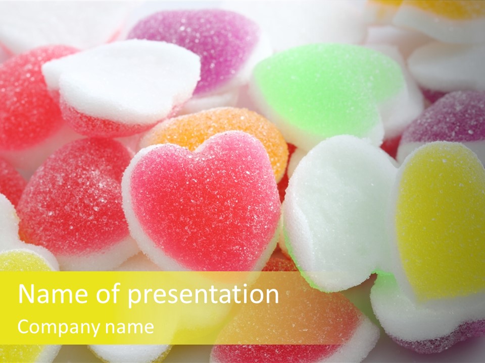 A Pile Of Candy Hearts Sitting On Top Of A Table PowerPoint Template
