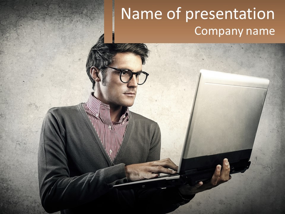 A Man In Glasses Using A Laptop Computer PowerPoint Template