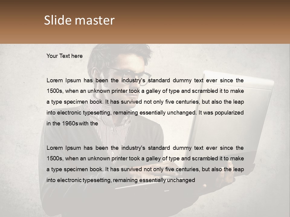 A Man In Glasses Using A Laptop Computer PowerPoint Template