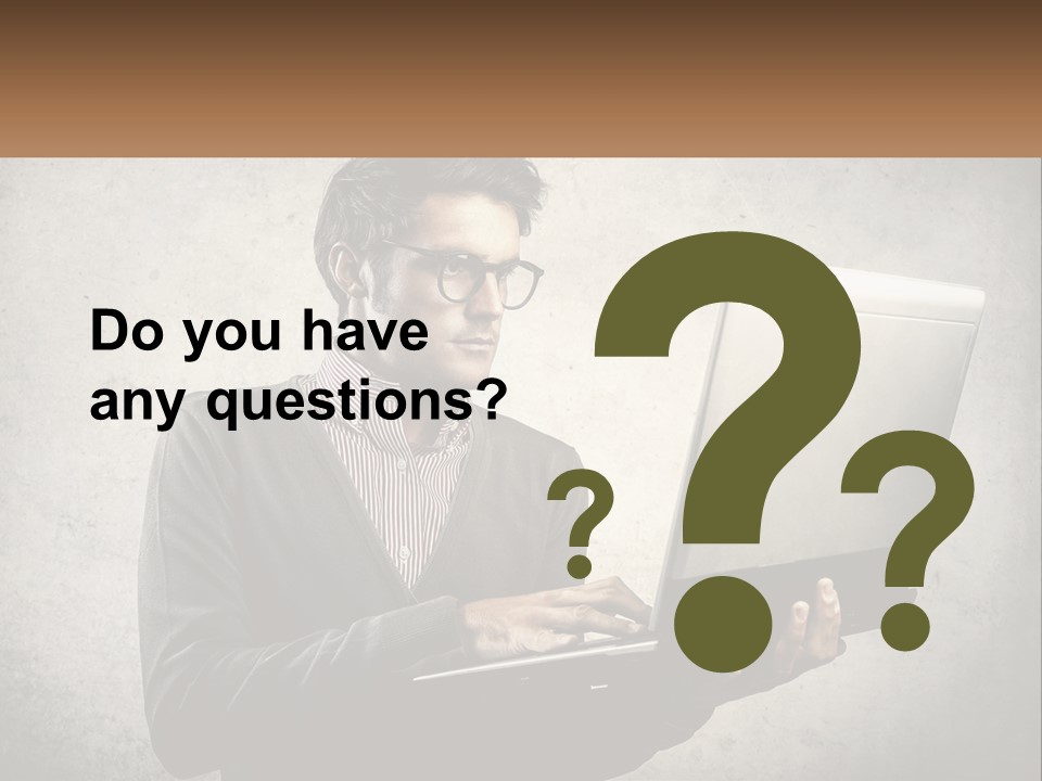 A Man In Glasses Using A Laptop Computer PowerPoint Template