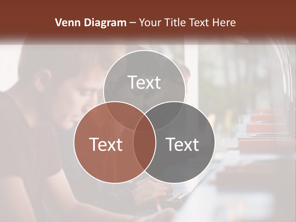 A Group Of Young Men Sitting At A Table Working On Laptops PowerPoint Template