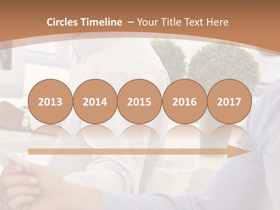 Two Men Shaking Hands In Front Of A Computer Screen PowerPoint Template