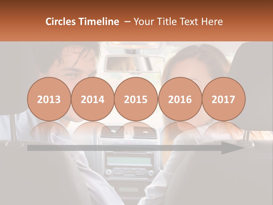 A Man And Woman Sitting In The Back Seat Of A Car PowerPoint Template