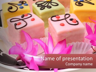A Plate Of Colorful Desserts With Pink Flowers PowerPoint Template