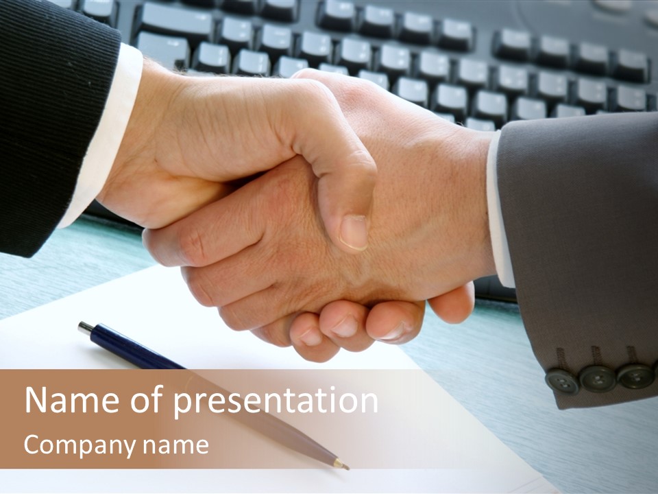 Two People Shaking Hands In Front Of A Keyboard PowerPoint Template