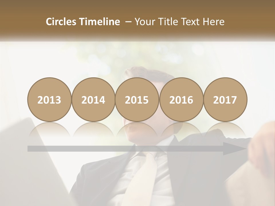 A Man In A Suit Sitting In Front Of A Laptop PowerPoint Template