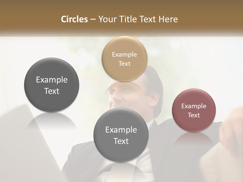 A Man In A Suit Sitting In Front Of A Laptop PowerPoint Template