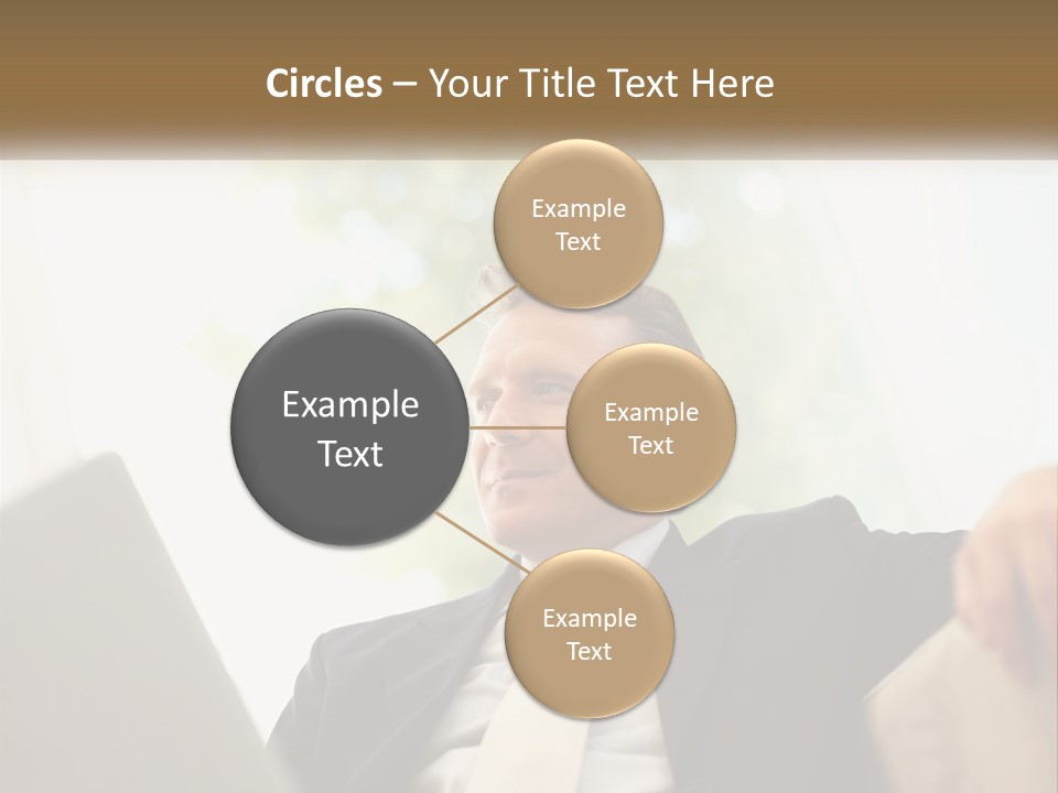 A Man In A Suit Sitting In Front Of A Laptop PowerPoint Template