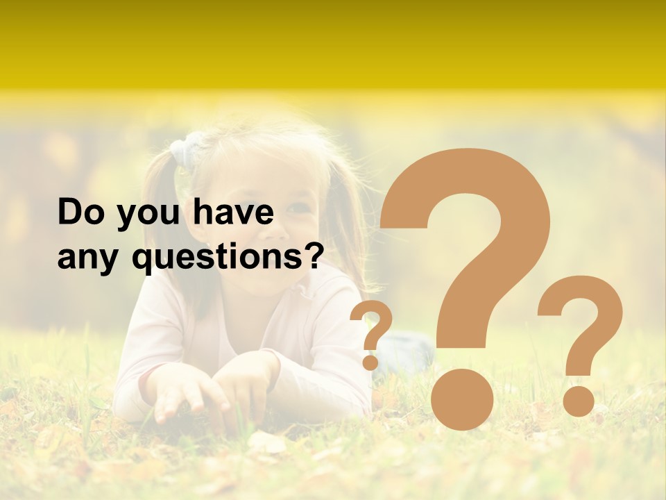 A Little Girl Laying On The Grass In A Park PowerPoint Template