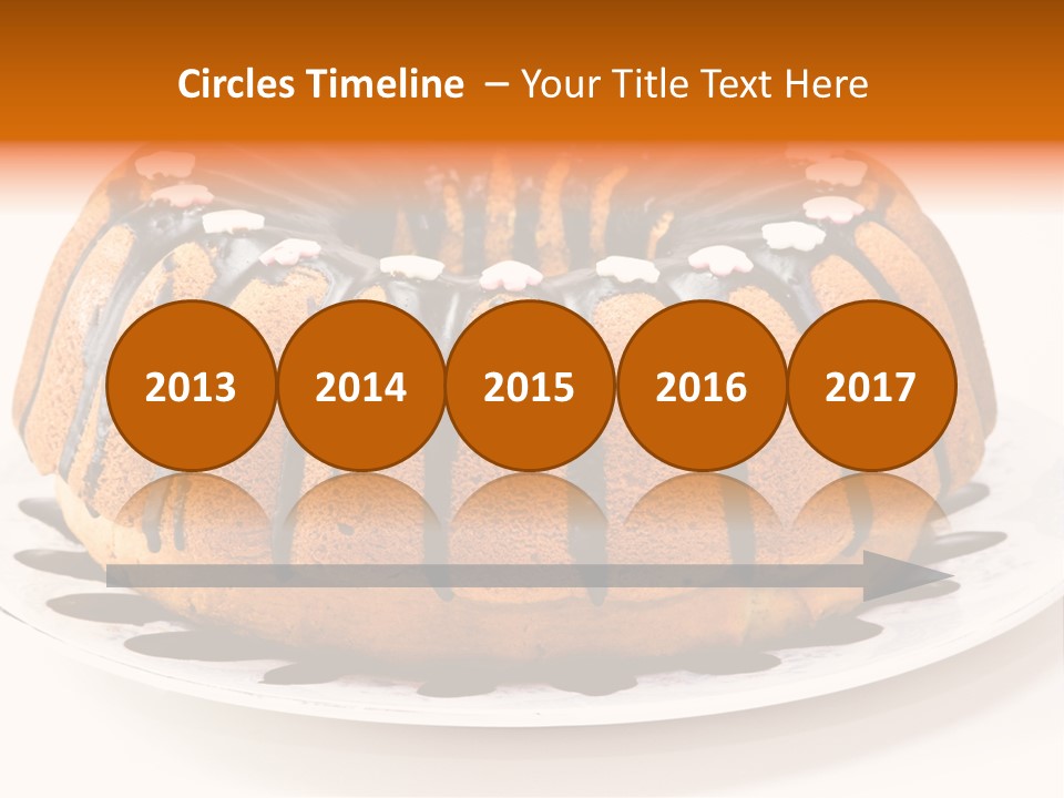 A Bundt Cake With Chocolate Icing On A Plate PowerPoint Template