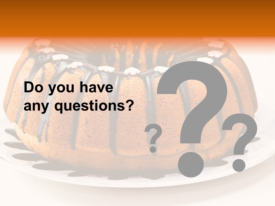 A Bundt Cake With Chocolate Icing On A Plate PowerPoint Template