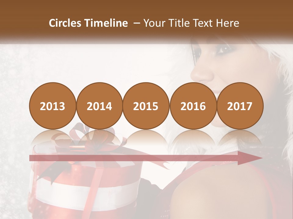 A Woman In A Santa Hat Holding A Present PowerPoint Template