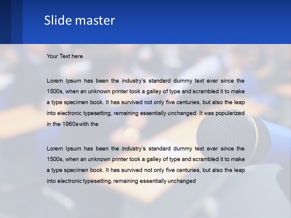 A Microphone In Front Of A Lecture Hall Full Of People PowerPoint Template