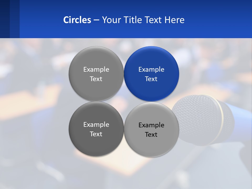 A Microphone In Front Of A Lecture Hall Full Of People PowerPoint Template