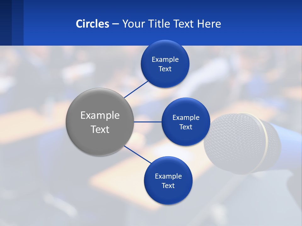 A Microphone In Front Of A Lecture Hall Full Of People PowerPoint Template