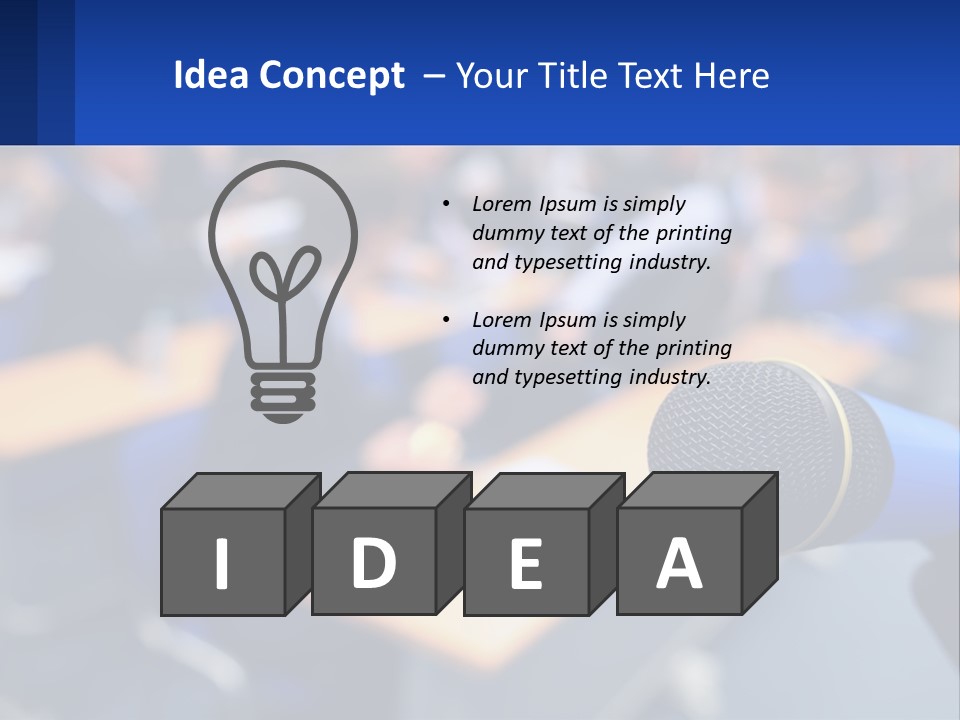 A Microphone In Front Of A Lecture Hall Full Of People PowerPoint Template