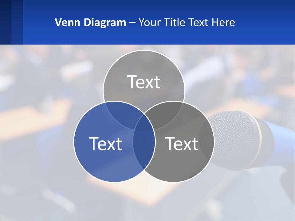 A Microphone In Front Of A Lecture Hall Full Of People PowerPoint Template