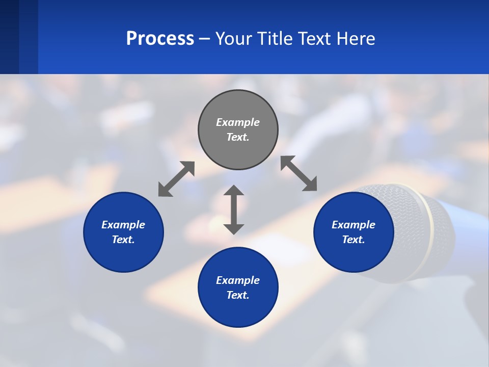 A Microphone In Front Of A Lecture Hall Full Of People PowerPoint Template