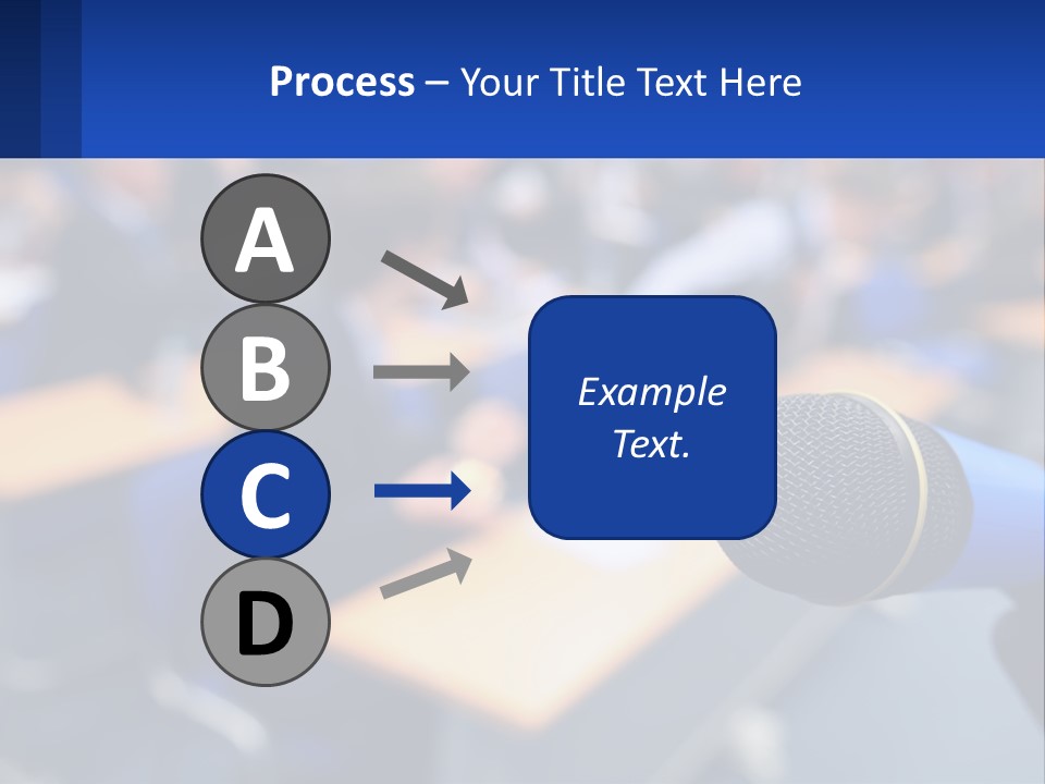 A Microphone In Front Of A Lecture Hall Full Of People PowerPoint Template