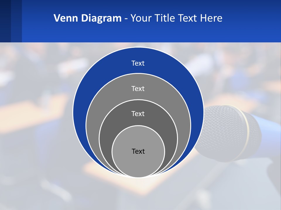 A Microphone In Front Of A Lecture Hall Full Of People PowerPoint Template