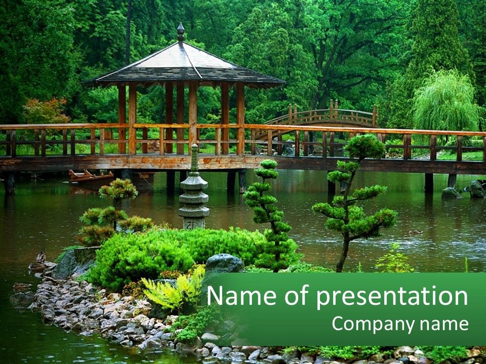 A Wooden Bridge Over A Pond With Rocks And Trees In The Background PowerPoint Template