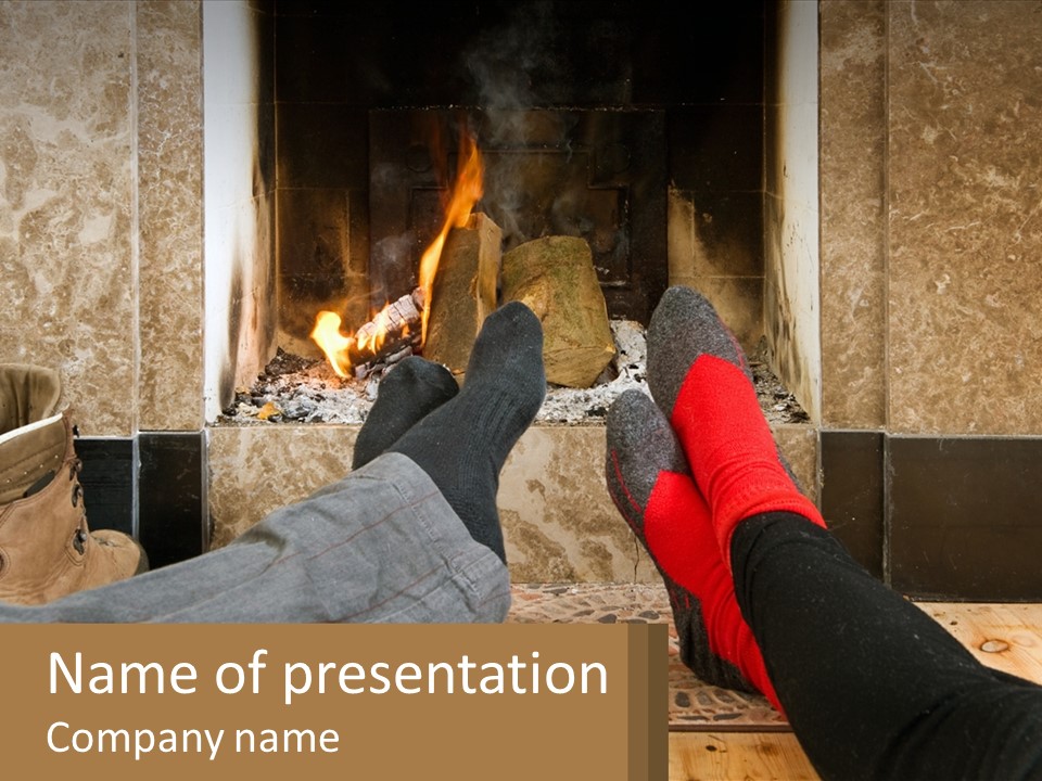 A Person Sitting In Front Of A Fireplace With Their Feet Up PowerPoint Template