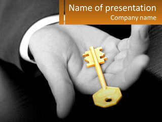A Person Holding A Key In Their Hand PowerPoint Template