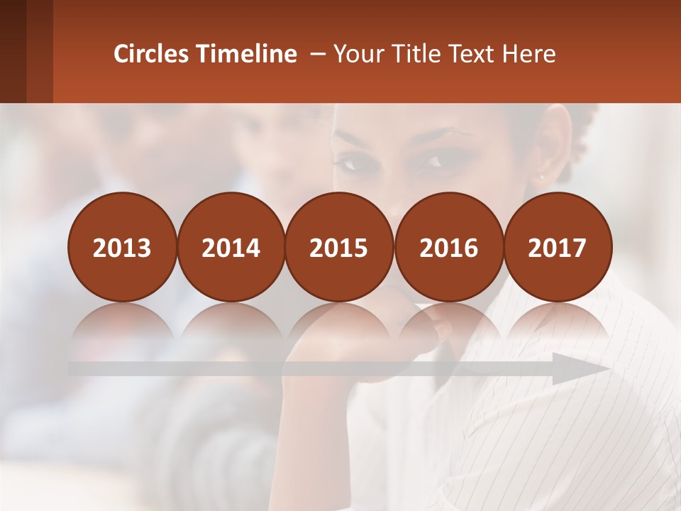 A Group Of People Sitting At A Table In Front Of A Computer Screen PowerPoint Template