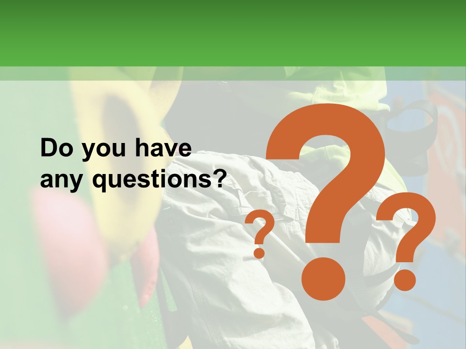 A Young Boy Climbing Up The Side Of A Climbing Wall PowerPoint Template