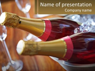 Two Bottles Of Wine Sitting On Top Of A Table PowerPoint Template