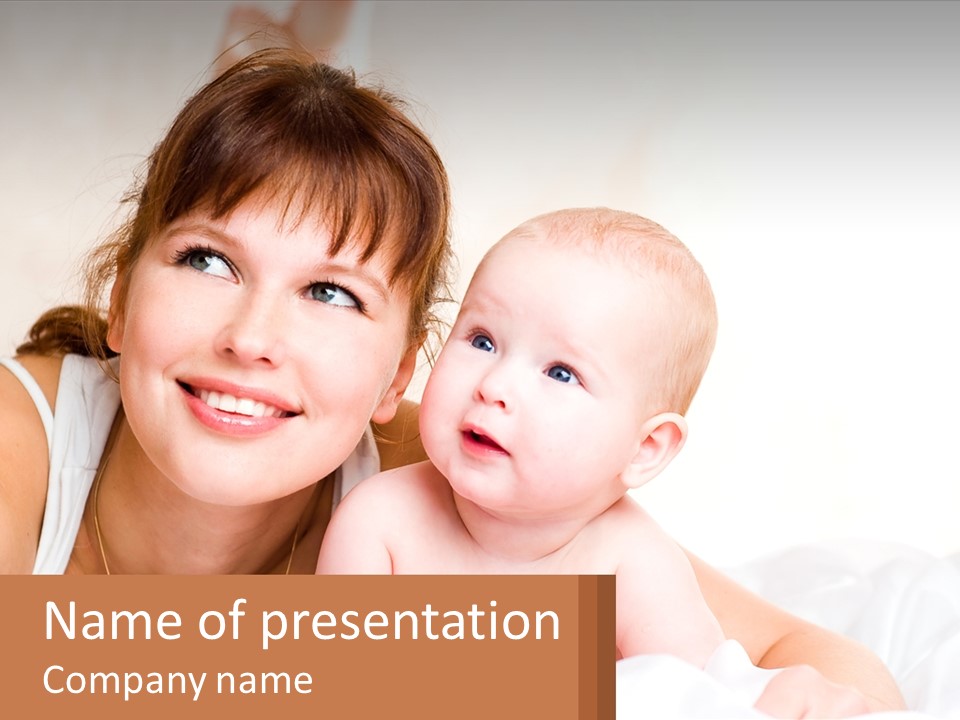 A Woman Holding A Baby In Her Arms PowerPoint Template