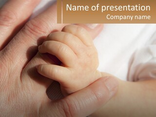 A Person Holding A Baby's Hand With A Name Tag PowerPoint Template