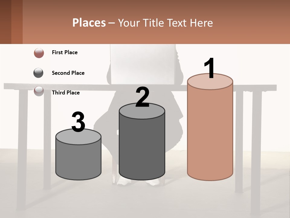 A Man Sitting At A Table Using A Laptop Computer PowerPoint Template